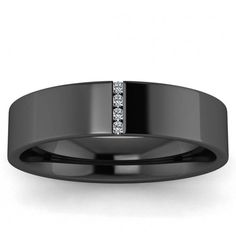 a black wedding band with two diamonds on it's center and an inlay