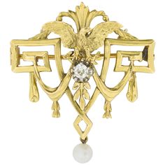 A Belle Époque carved yellow gold eagle brooch, of neo-classical design including swags, Greek-key motifs and a centrally carved eagle surmounting a single claw-set old brilliant-cut diamond estimated to weigh 0.2 carats, all mounted in gold and suspending an articulated single pearl drop, bearing French gold mark for 18ct gold, circa 1890, measuring 4 x 3.5cm, gross weight 8 grams. This antique brooch is in excellent condition for its age. This lovely French brooch was made in around 1890, during the Belle Epoque period. This brooch comes from the collection of Bentley & Skinner, the London jewellers by appointment to both Her Majesty the Queen and His Royal Highness the Prince of Wales and was created in the neoclassical style. The central eagle holds a lively diamond in its claws and is Victorian Jewellery, Neo Classical, Gold Eagle, Gold Brooch, Her Majesty The Queen, Silver Wings, Pendant Watches, Antique Brooches, Jewellery Shop