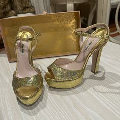 New Nilu Nilu Women’s Heels Style Your Night Out With These Gold Shimmy Heels Size 37.5 Bottom Of Heels May Look As They Were Worn Out But It Was In House When Trying On An Outfit. Decided Not To Wear Them And Never Ended Up Using Them. Reasonable Offers Always Accepted Thank You! Gold Heels With Ankle Strap And Deep Heel Cup, Gold Heels With Deep Heel Cup And Ankle Strap, Gold Block Heel Heels With Branded Insole, Platform Heels With Round Toe For Cocktail, Round Toe Platform Heels For Cocktail, Cocktail Platform Heels With Round Toe, Luxury Party Heels With Deep Heel Cup, Luxury Heels For Party, Blue Pumps Heels