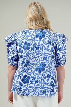 The Celeste Floral Poplin Ruffle Short Sleeve Top is the perfect top to wear out for your next brunch date or any event! It has a divine blue and white floral design print. Soft, cotton lightweight fabric, creates a keyhole neckline, and ruffle, puff half sleeves. Relaxed bodice features a poplin top to add details. Pair it with a please midi skirt for the ultimate look!- Puffed short sleeves- Keyhole- Ruffle detail- Cotton- Color: White Blue ComboSize + Fit - Model is 5'9" and wearing size 2X- Floral Print Flutter Sleeve Tops For Brunch, Flutter Sleeve Floral Print Top For Brunch, Garden Party Tops With Flutter Sleeves And Floral Print, Ruffle Sleeve Printed Top For Brunch, Blue Floral Print Ruffle Sleeve Blouse, Floral Print Flutter Sleeve Blouse For Brunch, Blue Floral Print Blouse With Ruffle Sleeves, Blue Ruffle Sleeve Blouse With Floral Print, Blue Floral Print Top For Garden Party