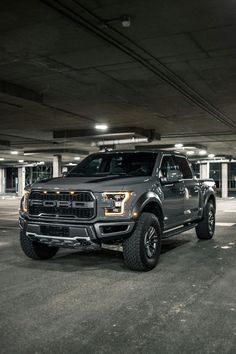 a large truck parked in a parking garage