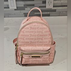 Juicy Couture Rosie Backpack Blush Pink, Macroon Dot Adjustable Straps Gold Colored Zippers On Exterior And Interior Logo Lined Interior Side Slip Pockets Perfect For Yourself Or As A Gift! See Photos For Details And Condition Open To Offers And Bundles Check Out My Other Listings For Additional Items Cute Pink Bag With Zipper Pocket, Trendy Pink Backpack With Zipper Pocket, Trendy Pink Satchel Backpack, Chic Pink Backpack With Adjustable Strap, Pink Zipper Closure Standard Backpack, Casual Pink Crossbody Backpack, Interior Logo, Logo Line, Bags Logo