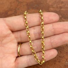 18K yellow gold solid rolo design chain link bracelet with matte-finish. 3D, round links in buttery yellow color- looks like 22K but is only 18k! SOLID, heavy, sturdy chain bracelet- perfect for daily wear. Clasp is shorter on any of the round links! Choose your length: 7.5" or 8" Shown on a 6" wrist Links measure: 4.8mm Solid links Large lobster clasp Stamped 18K Weight: 11.39 grams (7.5" length) OR 12.99 grams (8" length) Made in Italy Everyday Yellow Gold Rolo Chain Bracelet, Gold Rolo Chain Bracelet, 14k Gold Rolo Chain Link Bracelet, Yellow Gold Rolo Chain Bracelet, Yellow Gold Rolo Chain Link Bracelet, Gold-tone Round Bracelet With Solid Link, White Gold Bracelet, Rose Gold Pendant, White Gold Necklaces