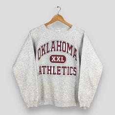 Vintage 90s Oklahoma XXL Athletics Football NCAA Sweatshirt Large OU Oklahoma University Printed Logo Jumper Oklahoma Sooners Sweater Size L Size On Tag :- Size L Manual Measurement :- WIDTH (armpit to armpit) :- 22" inches LENGTH (shoulder to end of garment) :- 25" inches WEIGH :- 0.38 kg Condition :- Good Condition. Has yellow stains at front, please refer a pictures. - Colors Might Be Different Due To Lighting. - All items are VINTAGE which show some signs of wear and tear. FEDEX EXPRESS = 3- Sweat Vintage, Miami Football, University Sweatshirts, Gray Sweatshirt, Embroidered Crewneck, Tennessee Volunteers, Champion Reverse Weave, Vintage Florida, Kentucky Wildcats