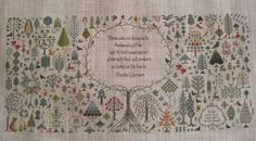 a cross stitch pattern with words on it and trees in the middle, surrounded by birds