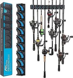 fishing rods and reels are hanging on the wall in front of a box for storage