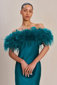 A bias cut long-sleeve silk gown with a halo of ostrich feathers across the bust. — Floor length — Coordinating, yet removable glove sleeves — Finger loops — Column silhouette Ostrich Feather Dress, Glove Sleeves, Evening Flats, Sandal Platform, Swimming Bag, Ostrich Feather, Silk Gown, Feather Dress, Cult Gaia