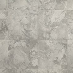 a tile floor with white and gray colors