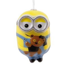 a yellow and blue minion ornament with googly eyes