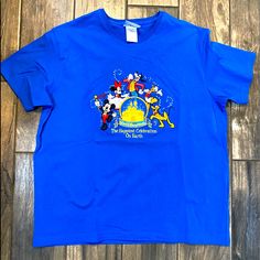 Nwot. Vintage Embroidered Disney Parks Happiest Celebration On Earth Shirt. Really Awesome Retro Shirt. Never Been Worn Or Washed. Blue Disney T-shirt For Disney Trips, Disney Graphic Print Blue Shirt, Blue Mickey Mouse T-shirt For Disney Events, Blue Mickey Mouse Short Sleeve Tops, Blue Mickey Mouse Tops For Disney Trips, Blue Short Sleeve Tops With Mickey Mouse, Blue Disney Tops For Disney Trips, Blue Disney Style Tops For Disney Trips, Blue Mickey Mouse Tops For Disney Fan Events