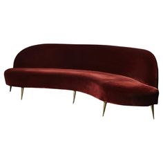 a red velvet couch with metal legs on an isolated white background for use in interior and exterior design