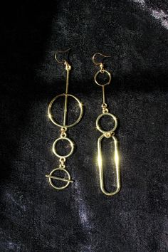 These mismatched shoulder duster earrings make quite a statement. They are sleek and modern, and lots of fun. The size and shape of the 2 mismatched earrings differ slightly but their weight is the same (4 g each), so the asymmetry of the design will not cause you any discomfort. However, if you're not a fan of mismatched earring styles, you'll have an option to order a matching pair - just select your preferred option before checkout. The earrings are made of gold tone base metal. But if you have sensitive ears, you can select a precious metal ear wire option that won't disagree with your skin. Vermeil is gold plated sterling silver. "Gold-filled" means a thicker coating of gold over a base metal. The 14kt gold-filled hooks I offer have a tiny hallmark. You won't be able to read it withou Modern Gold Linear Earrings In 14k Gold Filled, Minimalist 14k Gold Filled Earrings For Party, Modern 14k Gold-filled Linear Earrings, Minimalist 14k Gold Filled Party Earrings, Modern 14k Gold Filled Linear Earrings, Minimalist Metal Linear Earrings For Party, Minimalist Metal Threader Earrings For Party, Modern Brass Linear Earrings For Party, Shoulder Duster Earrings