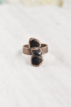 "Handmade with raw materials and intention, this raw black obsidian ring awakens the wild woman. Created with natural stones, each one organically different and individually unique just like you. Embedded in electroformed copper, inspiring a textured, earthy style. The black obsidian stone ring invites you to embrace your intuitive nature. Explore the forests, climb the mountains, and swim in the rivers. \"Letting go is where life begins.\" Trust your instincts and walk into the wild. Crystal pr Black Obsidian Jewelry, Black Obsidian Ring, Copper Electroforming, Obsidian Jewelry, Jewelry Wax, Black Obsidian Stone, Obsidian Ring, Raw Crystal Ring, Raw Gemstone Jewelry