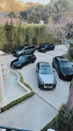 a group of cars parked in a driveway