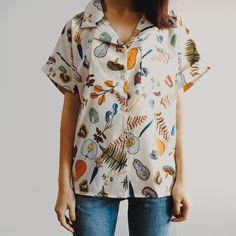 Short sleeve chiffon button up blouse with assorted plants and vegetables all over in a retro-styled illustration. S: 42.5" chest, 24.5" length M: 44" chest, 25" length L: 45.5" chest, 25.5" length Paint Shirts, Mesh Shirt, Crochet Shirt, Button Up Blouse, Indie Brands, Shirts Blouses, Sweater Blouse, Cardigan Jacket, Black Crop Tops