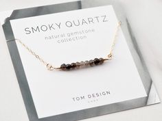 "Smoky Quartz Bar Necklace / Dainty Gemstone / Gemstone Necklace / Gemstone Bar Necklace / Birthstone Necklace / Birthday Gift / Quartz Necklace Our new Gemstone Necklaces are made from natural gemstone beads, with sterling silver, gold filled, or rose gold filled components. Stones are ethically sourced from around the world - we've found the best stones out there! Necklaces are packaged with our custom gemstone cards, then placed into our Tom Design logo stamped gift boxes. Perfect for gift gi Gemstone Bar Necklace, Permanent Jewelry, Necklace Birthstone, Gemstone Necklaces, Necklace Gemstone, Necklace Dainty, Quartz Necklace, Birthstone Necklace, Custom Necklace