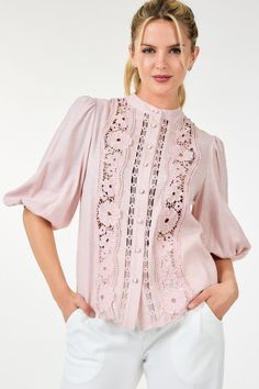 Indulge in the feminine elegance of our Women's 3/4 Lace Crochet Button Down Blouse. Crafted with delicate lace crochet, this top exudes sophistication and grace. The button-down design adds a touch of classic charm. Elevate your wardrobe with this exclusive and timeless piece. This top boasts delicate lace detailing that exudes femininity and refinement while its 3/4 sleeves strike a balance between coverage and freedom of movement. The collarless design lends a modern touch.Additionally the long popcorn sleeves add texture and visual interest elevating the tops overall appeal. - Solid - Round neckline I Collarless - Lace detailing - 3/4 Sleeve I Popcorn Elegant Pink Lace Blouse, Spring Button-up Blouse With Lace Collar, Elegant Lace Top With Crochet Trim, Feminine Spring Tops With Lace Collar, Feminine Spring Blouse With Lace Sleeves, Pink Lace Top With Lace Sleeves For Spring, Feminine Spring Lace Top, Feminine Lace Top For Spring, Spring Chic Crochet Lace Top