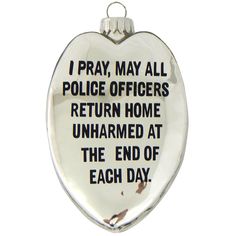 a heart shaped glass ornament with the words i pray, may all police officers return home unharmed at the end of each day