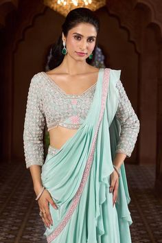 Aqua blue pre-draped lehenga saree with ruffled pallu and contrasting embroidered border. Comes with embroidered blouse. - Aza Fashions Draped Lehenga, Drape Lehenga, Ruffle Lehenga, Saree Gowns, Dhoti Saree, Cotton Sarees Handloom, Ruffle Sarees, Ruffle Saree, Drape Saree