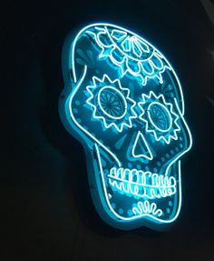 a neon sign that has a skull on it