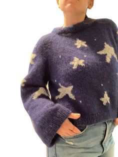 **THIS IS NOT THE ACTUAL SWEATER, THIS IS A DIGITAL DOWNLOAD FOR THE PATTERN PDF** For all Tim Burton and Halloween fans, this Coraline inspired sweater is the perfect statement piece for fall. Knitted from the top down with raglans. The stars are added after the entire sweater is finished, using duplicate stitch technique. I recommend being comfortable with knitting and purling in the round, increasing, and picking up stitches. The yarn is a combination of We Are Knitters Bling-Bling yarn and Sugar Bush Drizzle mohair, but if you'd rather knit with one strand instead of two, I'd recommend using a 3 weight yarn. Size Guide: Small - 20 inches across when laying flat, 18 inches from neck to hem, 15.5 inches in sleeve circumference, 17 inch sleeves measured from the armpit to wrist. Medium - Coraline Sweater, Stars Sweater, Sweater Knitting Pattern, Star Sweater, Looks Street Style, Sweater Knitting Patterns, Mode Inspo, Coraline, Tim Burton