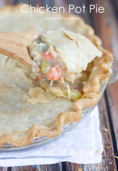 a chicken pot pie with a wooden spoon in it