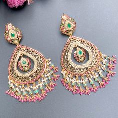 Featuring a pair of stunning gold plated chandbali earrings. These drop shaped chandbali earring have been crafted in 925 sterling silver and adorned with finest quality of stones. 22k Gold Jewelry Necklaces, Hyderabadi Jewelry, 22k Gold Jewelry, Chandbali Earrings, Pearl Necklace Set, Bollywood Jewelry, Gold Jewelry Necklace, Emerald Necklace, Gold Bangle Bracelet