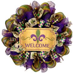 a purple and green wreath with a welcome sign