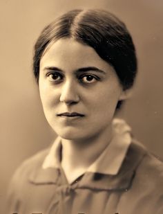 an old black and white photo of a woman's face with the caption, i am not sure what she is