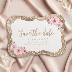 save the date card with pink roses and gold glitters on a light pink satin background