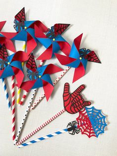 some red, white and blue pinwheels on a table