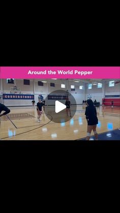 some people on a court with a pink and white banner in the background that says around the world peppar