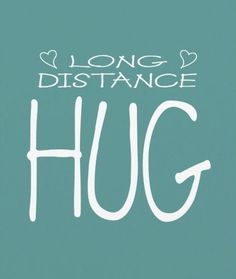 the words long distance hug written in white on a teal green background with hearts