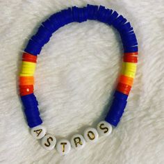 Get ready for the MLB season with your custom team bracelet. ⚾️ GO ASTROS ⚾️ ** This is listing for one bracelet. ** All bracelets are made to order. Please measure your wrist before ordering, we do not do offer refunds or exchanges if wrong size is ordered.   ** All letters are upper case. We have different colors available. ** We can also customize wording , just shoot us a message with what you are wanting. Bracelet Care: Do not leave out in the sunlight.  Do not expose to water. Remove before going to bed to prevent stretching/damage of bracelet. White Personalized Fan Merchandise Bracelets, Personalized Blue Bracelets For Sports Events, Customizable Adjustable Bracelets With Team Spirit, Personalized Multicolor Bracelets For Team Spirit, Houston Astros Crochet, Astros Bracelet Stack, Personalized Blue Bracelets For Game Day, Houston Astros Bracelet, Astros Gifts