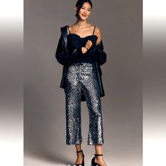 Anthropologie - The Colette Cropped Wide-Leg Sequin Pants By Maeve Polyester, Elastane; Viscose, Elastane Lining Zip Front Hand Wash Imported Size & Fit 11.5" Rise 24" Inseam 10.5" Leg Opening Elegant Silver Sequined Pants, Silver Sequined Pants For Night Out, Silver Sequin Evening Pants, Silver Wide Leg Bottoms With Sequins, Silver Sequined Wide Leg Bottoms, Glamorous Silver Pants For Fall, Silver Pants For Fall Party, Silver Sequin Pants For Party Season, Silver Pants For Night Out Party Season