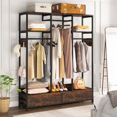 an organized closet with clothes, shoes and handbags on shelves next to a bed