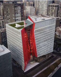 an aerial view of a large building with red and white stripes on it's side