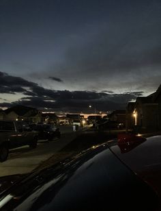 a car parked on the side of a road at night