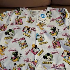 Disney Extra Large Top. Brand New With Tags! Themed White Tops With Character Print, Fun White Mickey Mouse Tops, Disney White Tops With Character Print, Christmas Scrub Tops, Disney Anniversary, Disney Tank Tops, Christmas Scrubs, Acid Wash Shirt, Disney Tanks