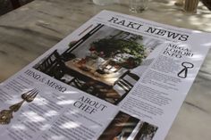 a table with a newspaper on top of it