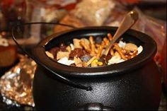 a pot filled with food sitting on top of a table