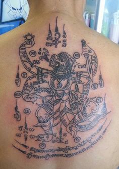 a man with a tattoo on his back