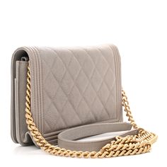 This is an authentic CHANEL Caviar Quilted Boy Wallet On Chain WOC in Grey. This stylish wallet is crafted of luxuriously textured diamond-quilted caviar leather in light grey. The crossbody bag features an aged gold chain link crossbody strap with leather shoulder pad and a faux Chanel closure on the facing flap. The crossover flap opens to a matching fabric and leather interior with a zipper compartment, card slots, patch pockets. Chanel Chain Bag, Chanel Crossbody, Quilted Wallet, Chanel Shoulder Bag, Wallet On Chain, Chanel Caviar, Mini Wallet, Chanel Wallet, Chain Bags