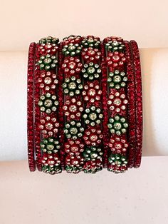 𝗗𝗲𝘀𝗰𝗿𝗶𝗽𝘁𝗶𝗼𝗻 This Customizable 10 pcs glass bangles set is trending crafting creation that gives the manifest look and style. This intellectual style designer bangle set is a remarkable piece of hand jewelry that perfectly goes with any Indian wear suits and sarees you well. A perfect bangle set for parties, functions, receptions, weddings and Festivals. This unique bangle bracelet set is glamorously impressive, yet subtle, the design is clean and extremely accurate and suited to any kind of event, both formal and informal, featuring an amazing! 𝗣𝗿𝗼𝗱𝘂𝗰𝘁 𝗗𝗲𝘁𝗮𝗶𝗹𝘀 An Indian styled Bangle Set. Trending Handmade 10 Pcs Glass Bangle Set (Make Your Own Style Set) Color- Maroon Green Origin -  India Set - (10 Pieces) Bangle Set Approximate Weight - 100 Grams 𝗡𝗢𝗧𝗘 As thi Traditional Stackable Bracelets For Party, Unique Bangle For Festivals, Indian Wear Suits, Intellectual Style, Unique Bangle, Glass Bangles, Bangles Set, Bangle Bracelet Set, Bangle Designs