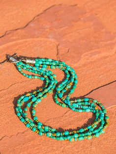 Small multi strand Kingman turquoise pebbles, Soft seafoam tones accented with brown copper matrix, my favorite! 22 inch length multi strand with heavy hand stamped sterling cone and toggle closure. Three or four strands as these are sold by weight. We do our best to stock these, two to three weeks if we have to make one from scratch! You will love this piece! Sunburst Squash, Hat Maker, Turquoise Stone Jewelry, Pebble Necklace, Single Braid, Chunky Choker, Wedding Cuff, Brown Copper, Sister Necklace