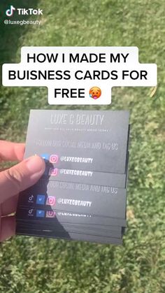 someone holding up some business cards for free