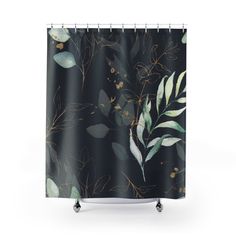 a black shower curtain with leaves and branches on the outside, in front of a white background