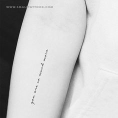 a person with a tattoo on their arm that says, i love you to the moon and back