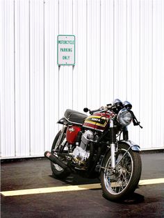 a motorcycle parked in front of a white building