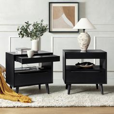 two black end tables sitting on top of a white rug